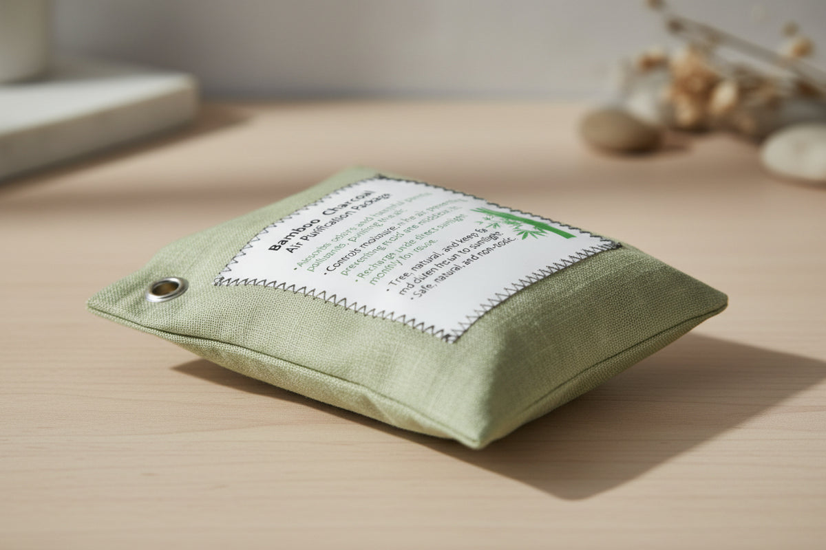Green fabric pouch with a label on a beige surface